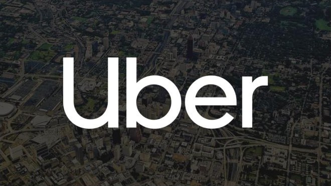 The Uber wordmark over an aerial view of Atlanta, the title slide of the team’s deck